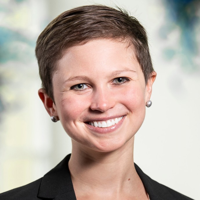 A woman smiles in a photo